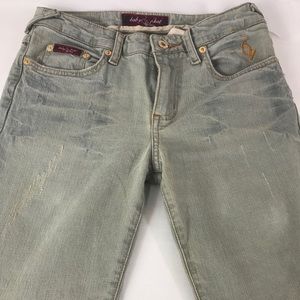 Size 5 Baby Phat jeans with logo decal
